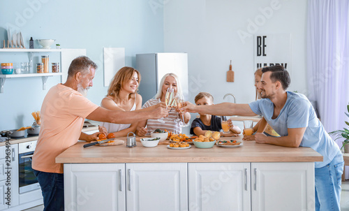 Big family clinking glasses...