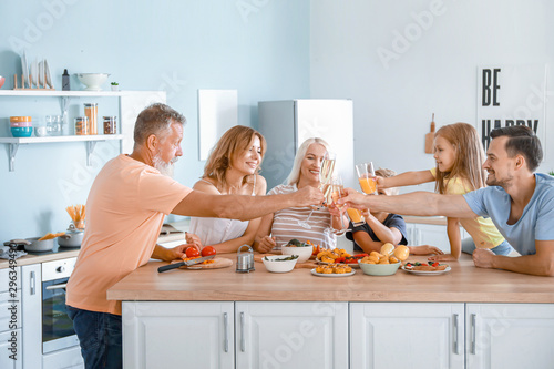 Big family clinking glasses...