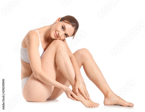 Woman with beautiful legs after depilation on white background photo