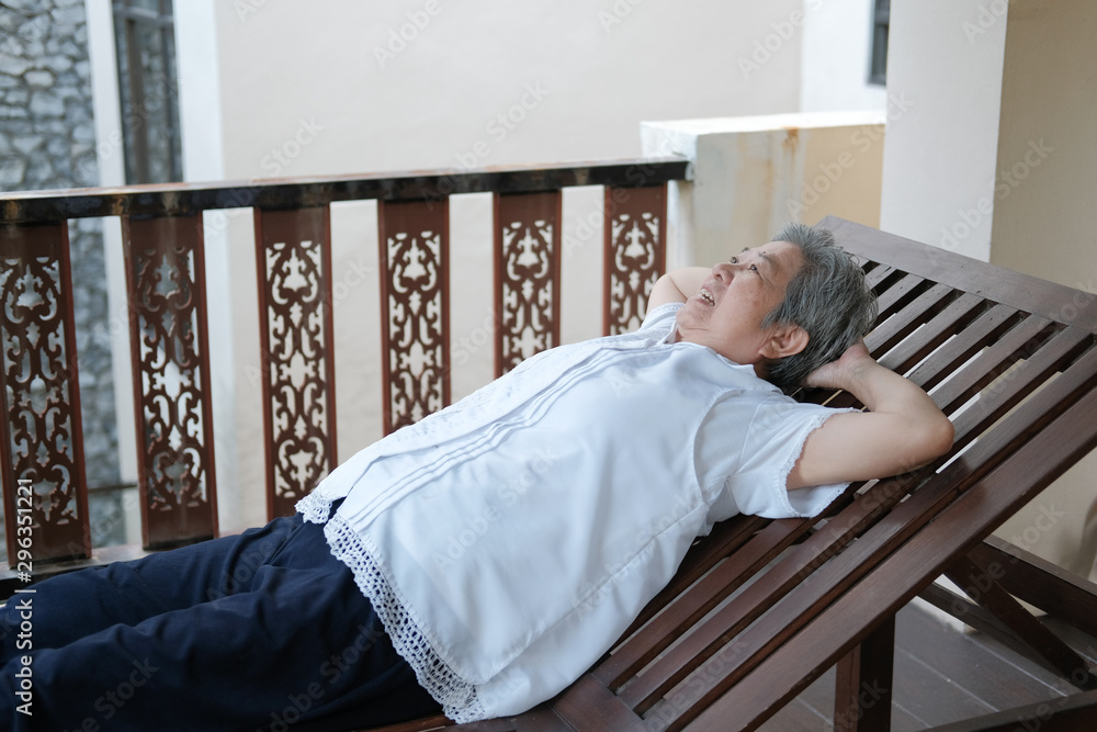 old elderly elder senior woman resting relaxing on terrace balcony old elderly elder senior woman resting relaxing on terrace balcony