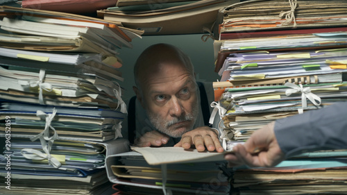 Canvastavla Creepy office clerk overloaded with paperwork