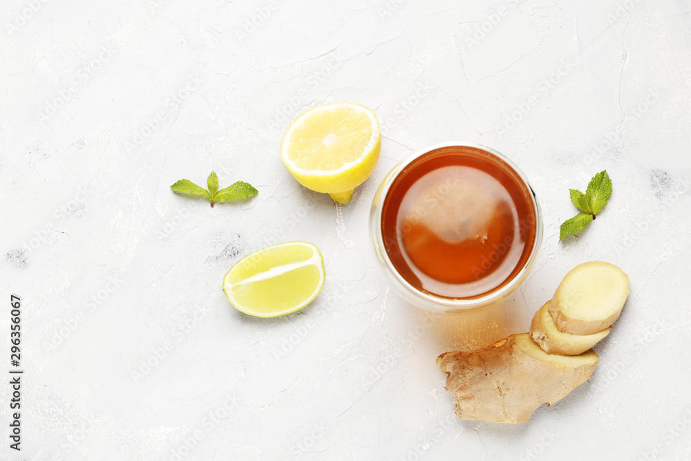 cup of hot tea with ginger, lemon and mint isolated on a white background cup of hot tea with ginger, lemon and mint isolated on a white background