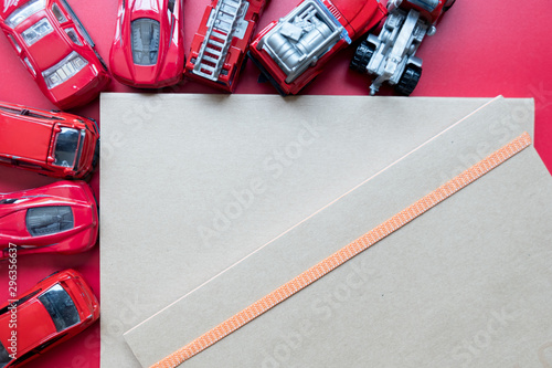 Red toy car and empty notebook
