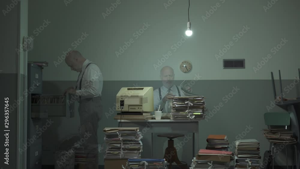 Office worker searching for files in a messy office