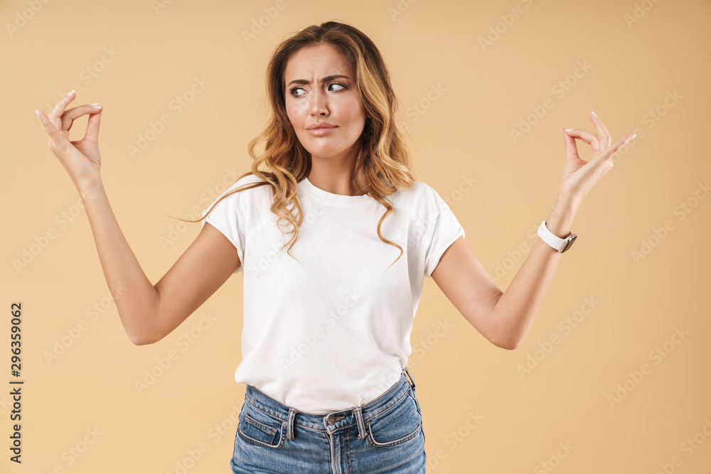 Portrait of caucasian woman wondering and looking at copyspace in her fingers Portrait of caucasian woman wondering and looking at copyspace in her fingers
