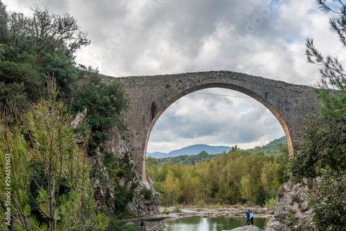View of the old medieval bridge of Llierca, in the region of La Garrotxa, Girona, Spain. photo