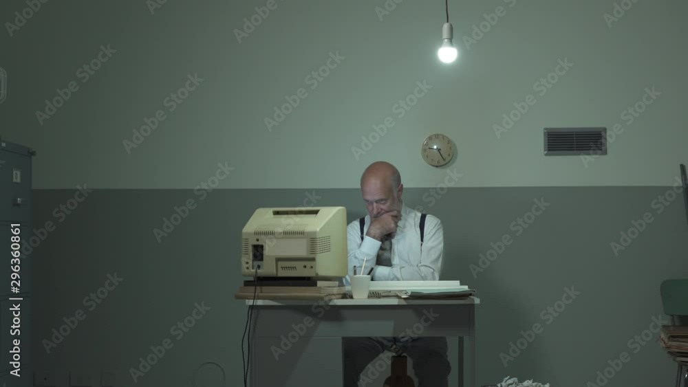 Bored office clerk staring at the computer screen