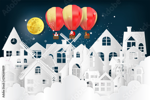 Paper art and cut of Santa Claus   snowman and Reindeers on the snow winter house and merry christmas background as digital craft style   holiday and x mas day concept. vector illustration.