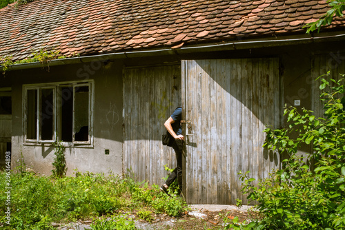 Man walking into barn