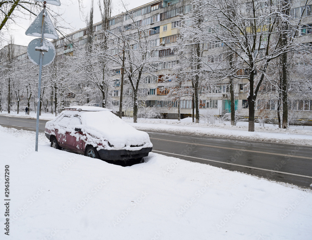View of the road asphalt and snow machine in the city in winter. View of the road asphalt and snow machine in the city in winter.