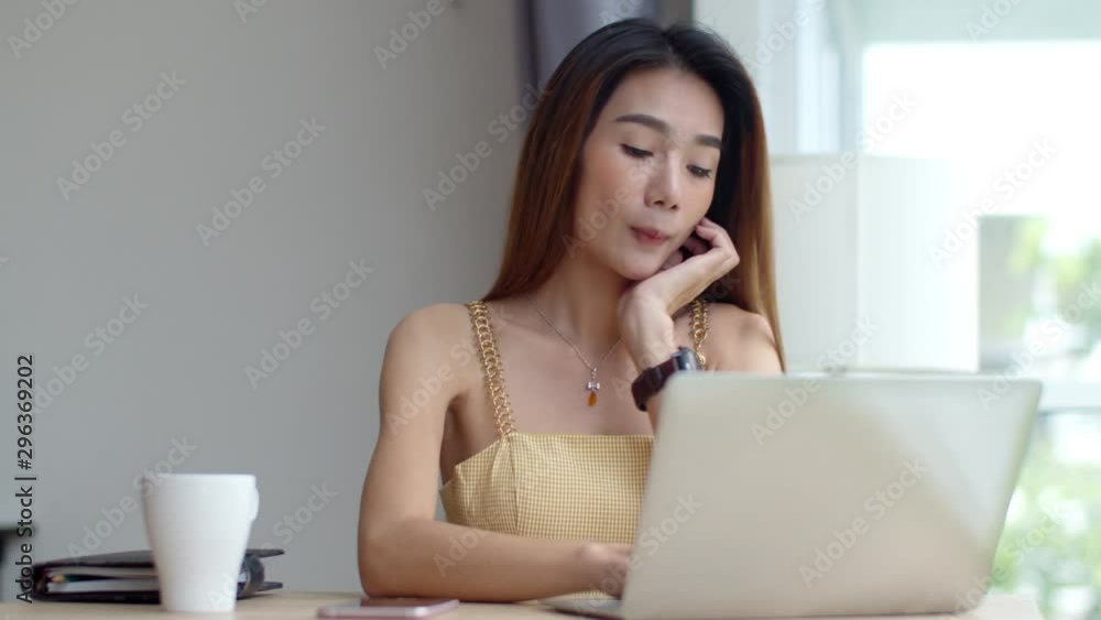 Young beautiful woman working with laptop at coffee shop Young beautiful woman working with laptop at coffee shop