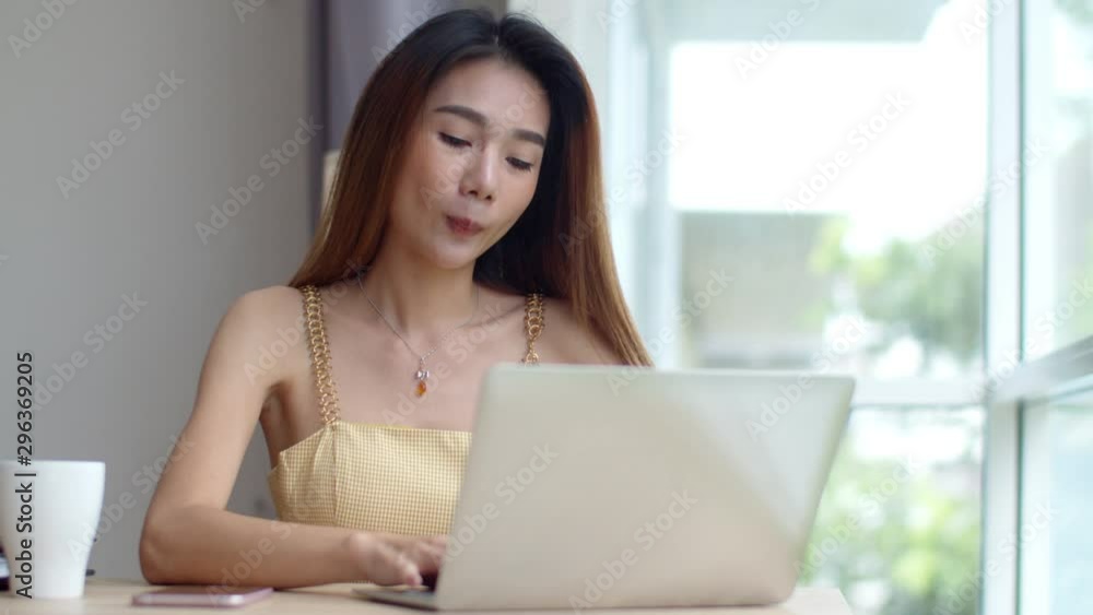 Young beautiful woman working with laptop at coffee shop Young beautiful woman working with laptop at coffee shop