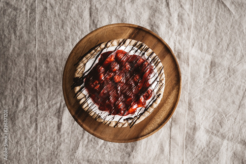 Mini cherry pie with chocolate sauce drizzled on top