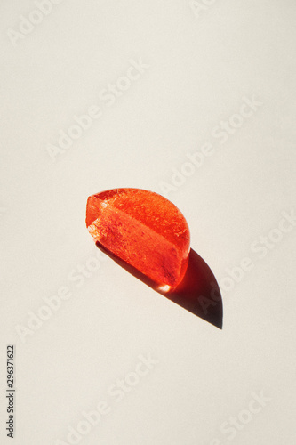 Semisphere orange object on white surface photo