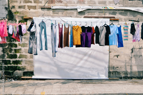 Wallpaper Mural Clothing on clothesline in front of old building Torontodigital.ca