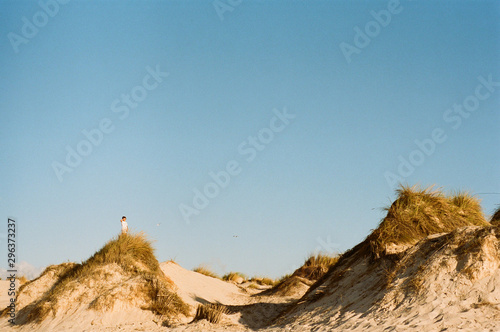 Boy standing on a hill