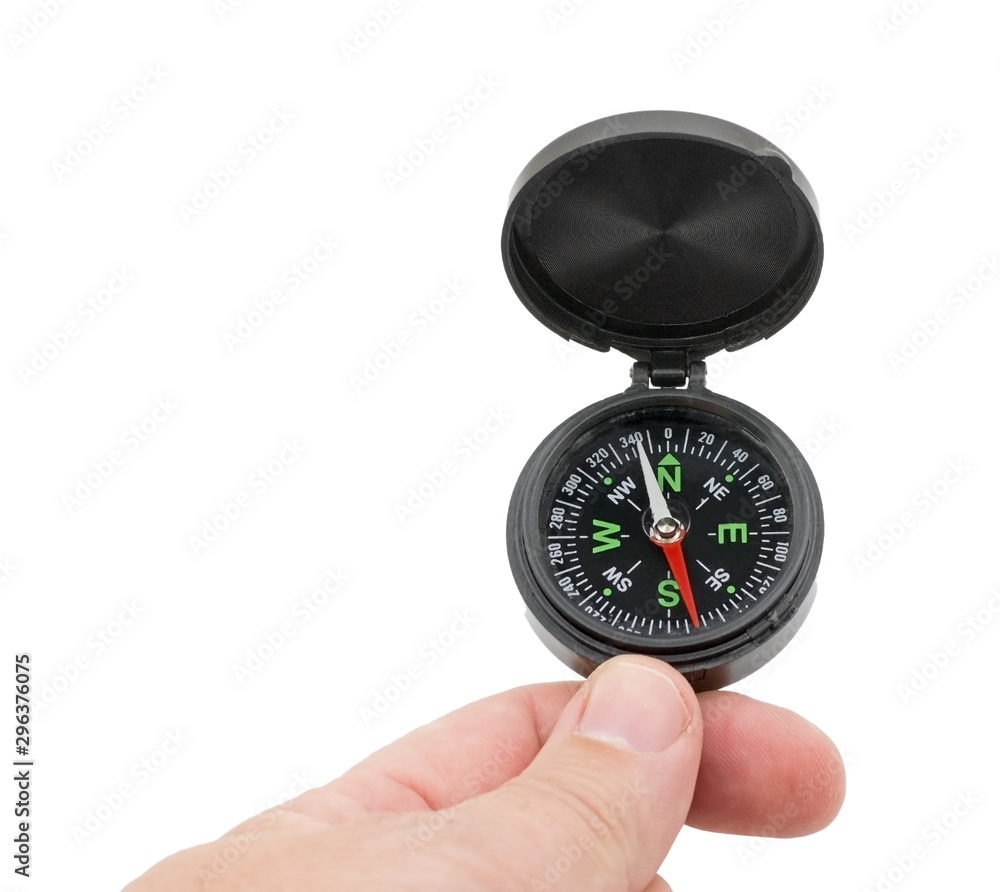 compass in hand on a white background compass in hand on a white background