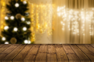 Image of wooden table in front of abstract blurred lights background