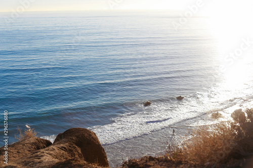 High angle view of minuscule person on beach shore