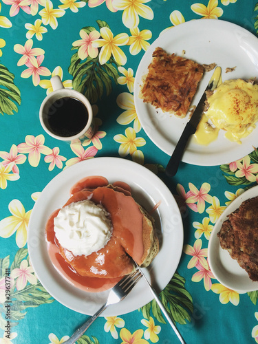 Overhead view of desserts on plates and coffee cup