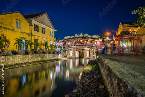 Japanese Covered ancient Bridge and River in Street in Old city of Hoi An in Southeast Asia in Vietnam. Vietnamese heritage and culture in Hoian at night