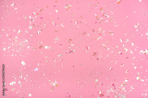 Fototapeta Pearl confetti on pink background.