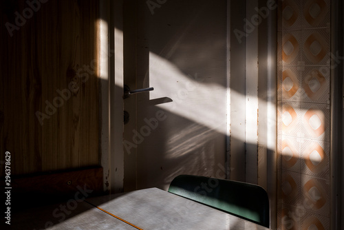 Interior view of table and chair in closed room