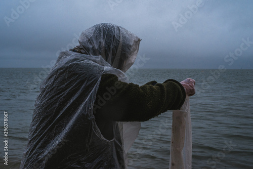 Side view of person standing by sea