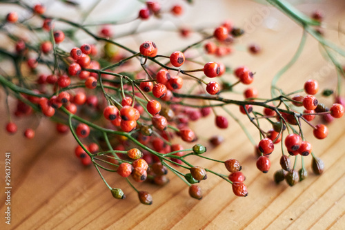 Close up of pink peppercorns on table photo