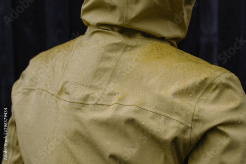 Back view of a man wearing raincoat photo