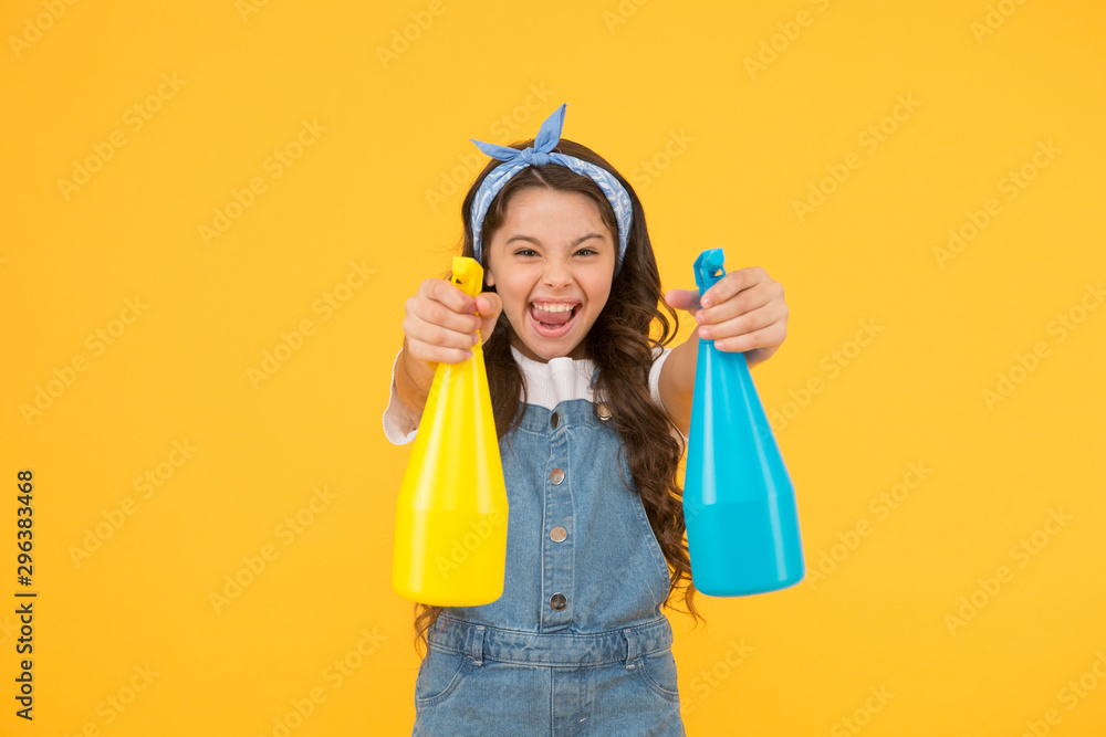 My home cleaned my way. Happy small girl clean home on yellow background. Little home keeper hold spray bottles. Home in hand of cleaning service. Housekeeping duties My home cleaned my way. Happy small girl clean home on yellow background. Little home keeper hold spray bottles. Home in hand of cleaning service. Housekeeping duties