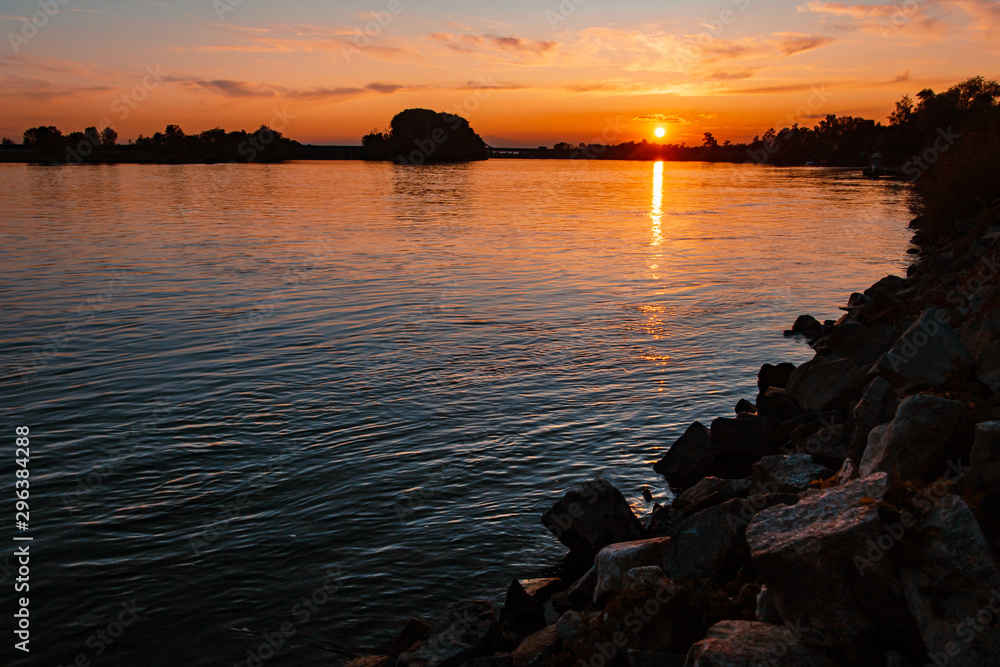 Beautiful sunset with reflections in the river danube near Metten, Bavaria, Germany