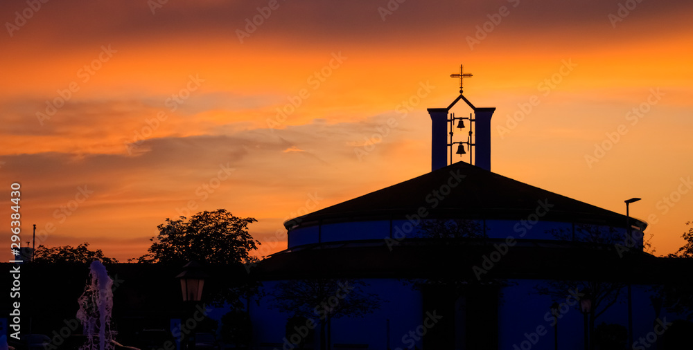 Beautiful sunset with a church silhouette at Bad Griesbach Therme, Bavaria, Germany