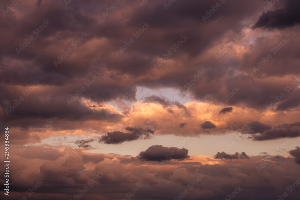 The morning sky with clouds covered in orange light. The morning sky with clouds covered in orange light.