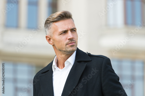 Businessman concept. Men get more attractive with age. Facial care and ageing. Traits and behaviors that make men more appealing. Attractive mature man. Mature guy with grey hair and bristle photo