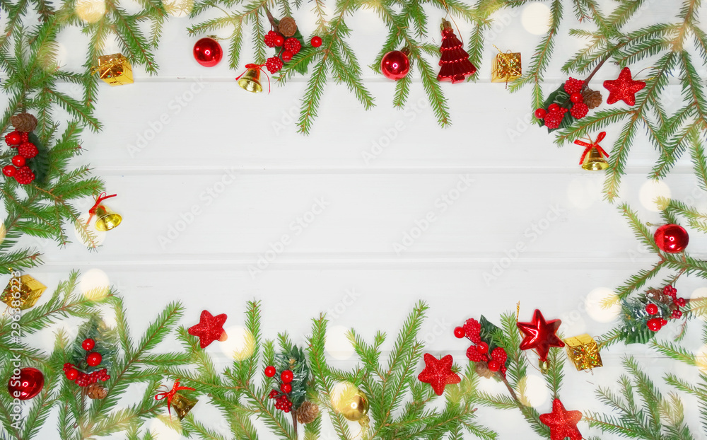 christmas decoration and garland lights on white wooden background