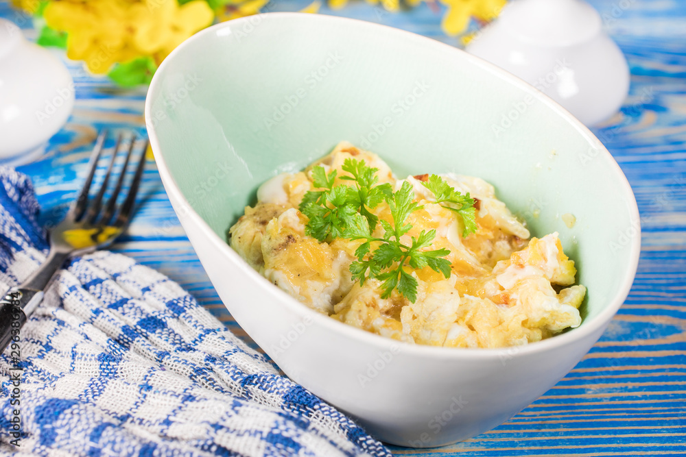 Scrambled eggs with onion.