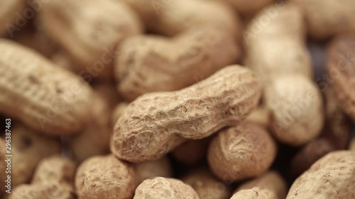 a lot of peanuts in shell background. healthy nutritional product, vegetable protein
