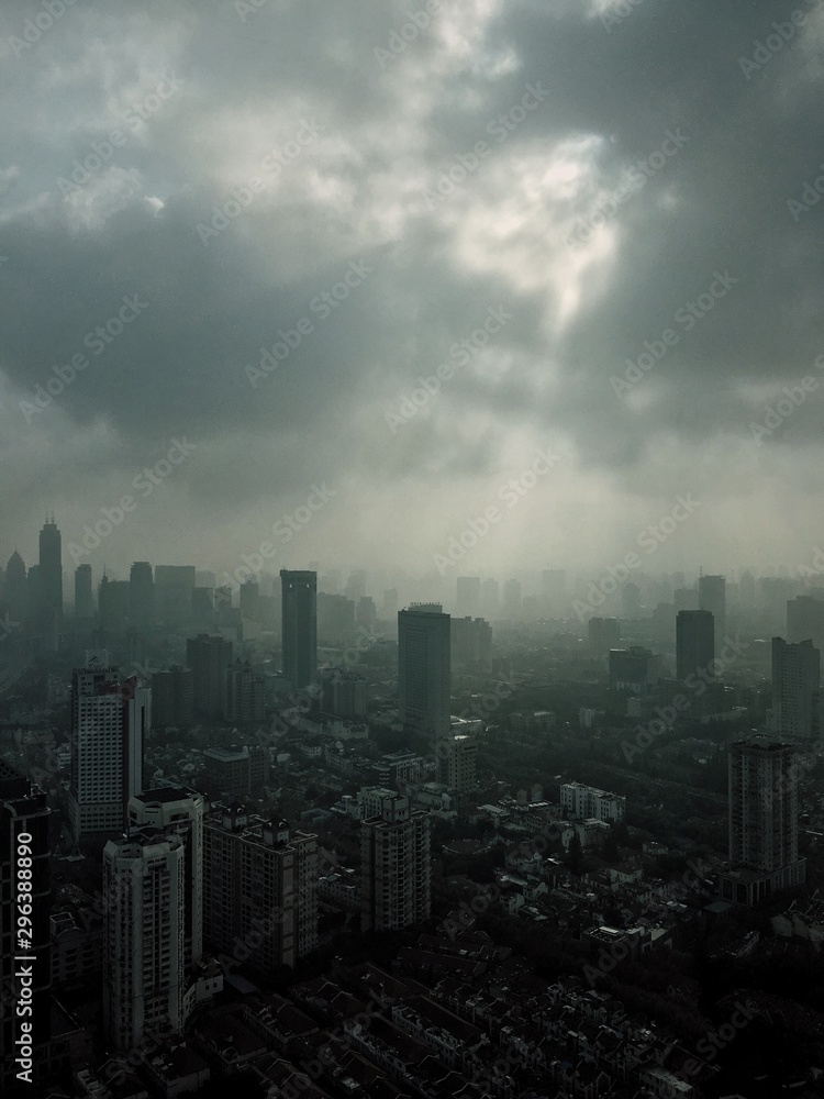 View of cityscape against cloudy sky View of cityscape against cloudy sky