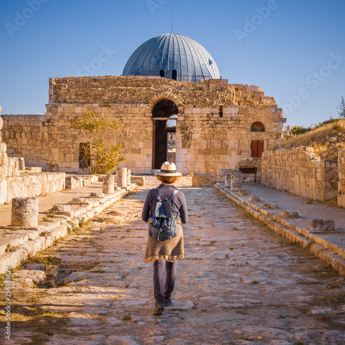 Cuadro en lienzo Lady walking along Colonnated Street toward the Monumental Gateway at Umayyad Pa