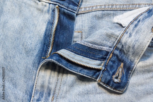 Trendy stylish jeans frayed and torn in different places.