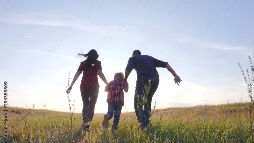 happy family father a son and mom run go slow motion funny video concept. happy teamwork dad man mom girl and son boy child running hold hands lifestyle run go on the field in nature . happy family happy family father a son and mom run go slow motion funny video concept. happy teamwork dad man mom girl and son boy child running hold hands lifestyle run go on the field in nature . happy family