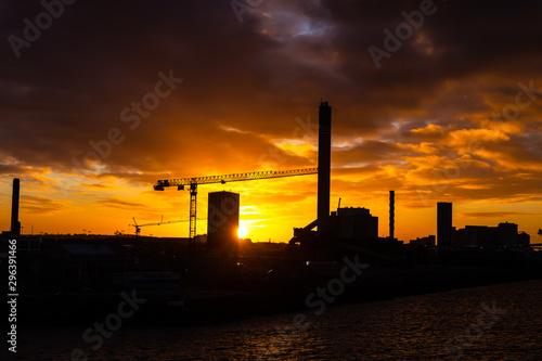 Colorful sunset over sea port and industrial cranes, Helsingborg, Sweden
