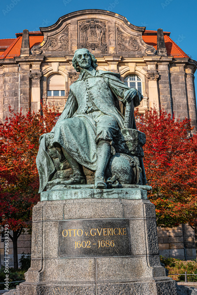 Statue of great scientist Otto Guericke in Magdeburg in red and golden Autumn colors, Germany Statue of great scientist Otto Guericke in Magdeburg in red and golden Autumn colors, Germany