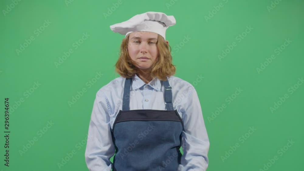 Kung Fu Woman Cook Fighting With The Dark Spirit Of The Kitchen. Studio Isolated Shot Against Green Screen Background