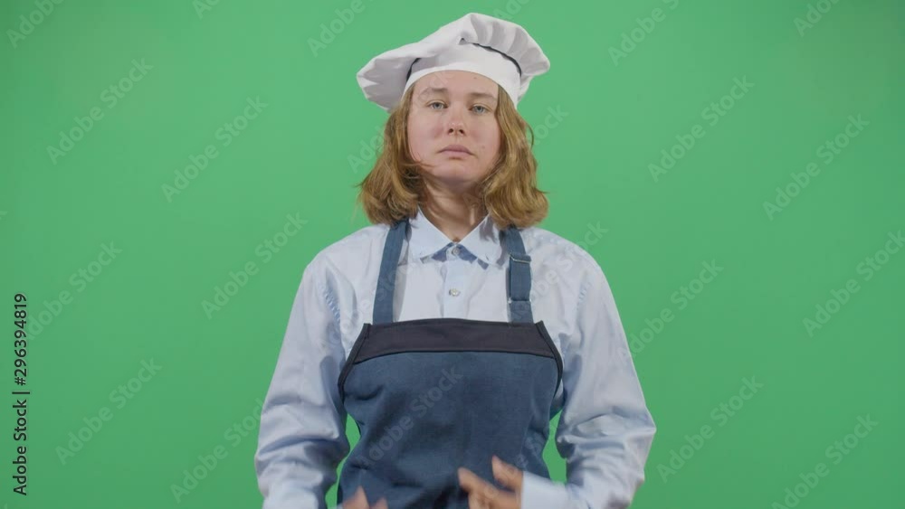 Cook Mouth Cleanning With The Apron. Studio Isolated Shot Against Green Screen Background Cook Mouth Cleanning With The Apron. Studio Isolated Shot Against Green Screen Background