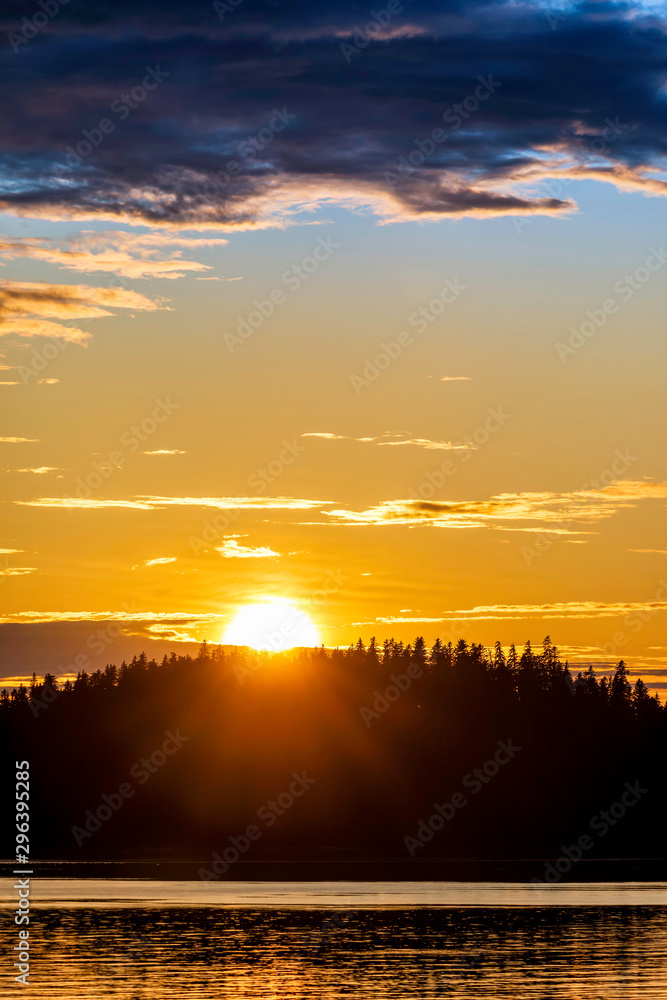 Sun Setting Behind Silhouetted Trees, Mountain
