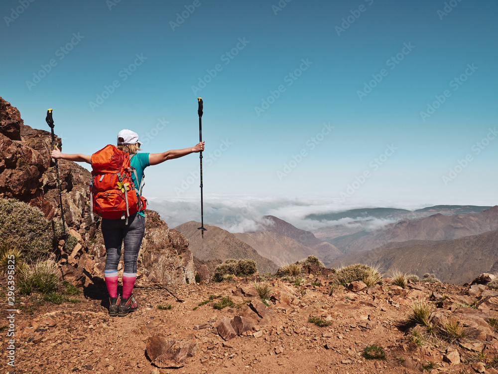 Blonde tourist backpacker girl looking to the distance in Morocco - obrazy, fototapety, plakaty 