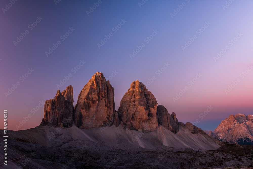 Tre Cime di Lavaredo in beautiful light at sunrise in the Sexten Dolomites, South Tyrol, Italy