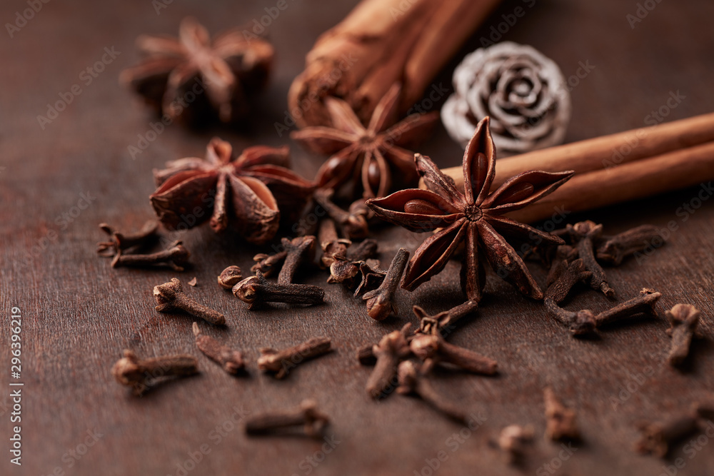 Star anise, cinnamon and dry spice cloves. Christmas spices on rustic wooden background. Close up. Star anise, cinnamon and dry spice cloves. Christmas spices on rustic wooden background. Close up.